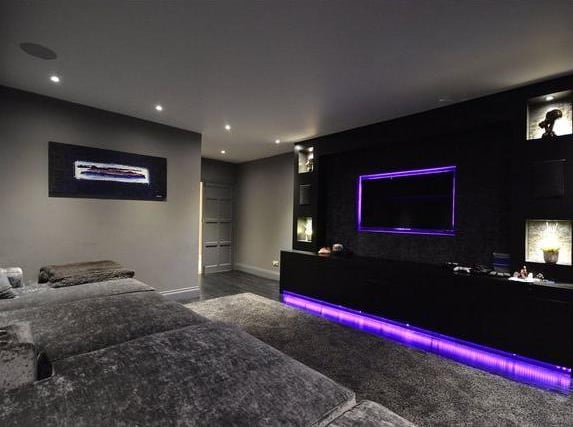 The incredible cinema room has a built in fridge and huge TV
