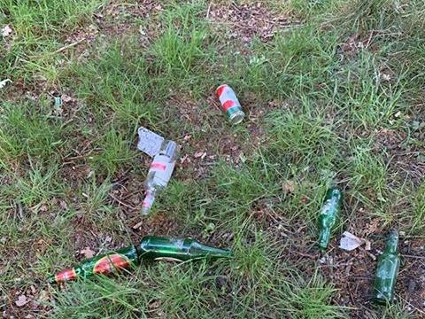 Glass bottles were discarded over a wide area.