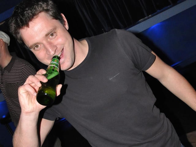 Dick enjoys a beer in Mansion.