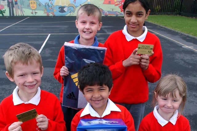 St. Augustines RC School pupils with their Gold Cards and prizes for reading, back row from left, Michael Bates and Krupa Purohit, front, Kieran Shallcross, Nikesh Modessa and Lisa Chattell