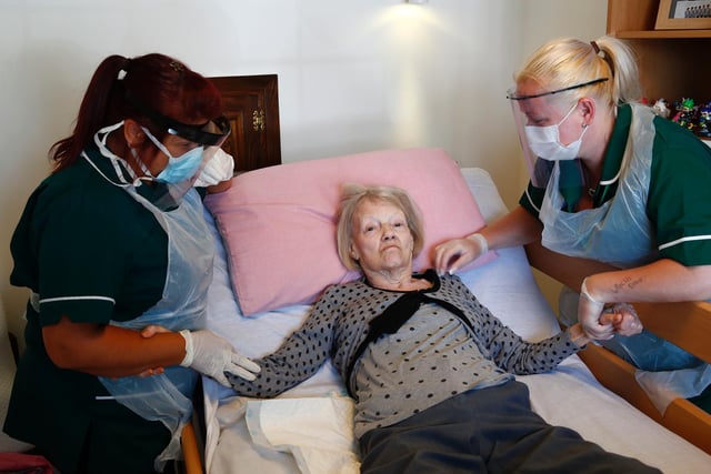 Covid-19 survivor, 83-year-old Marjorie Brunskill, the mother of the photographer, receives attention from NHS crisis team workers Angela and Clare after returning home from hospital, after testing negative for coronavirus (COVID-19), on May 27, 2020 in Blackpool (Picture: Clive Brunskill/Getty Images)