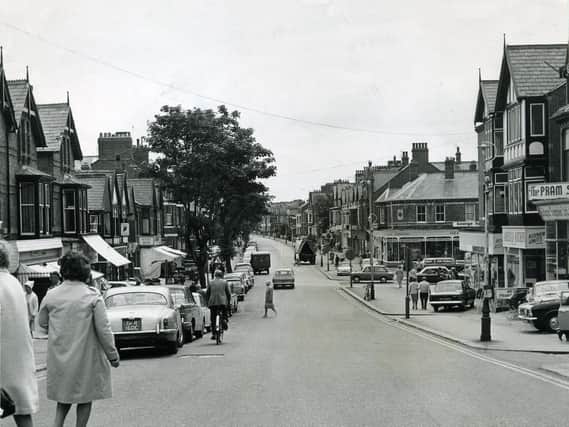 This view of St Andrew's Road South from The Crescent has changed little since this photograph was taken in 1969. The trees have gone along with the canvas window shades, and cars no longer park on the forecourts, but there is still a variety of small shops popular with locals and visitors.