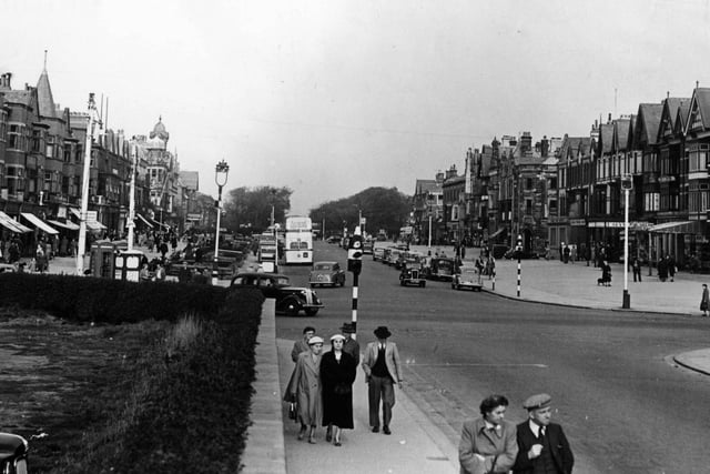A 1953 view of St Annes Square, looking inland across Clifton Drive North to the wide expanse of pavements either side of St Annes Road West. Burton's gents outfitters stands on one corner and Sander's store on the other.