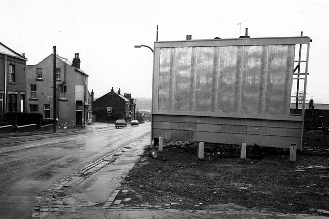 Looking north-east along Elland Road from the junction with Little Lane. In the foreground is a blank advertising hoarding. On the left are no.s 26-20 Elland Road followed by the New Inn public house.