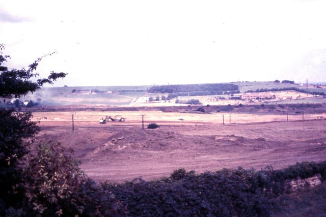 View taken from Sanderson's farm at Churwell, looking over Daffil Wood towards Cottingley Springs, showing construction work on the M621 Gildersome to Leeds motorway in progress.