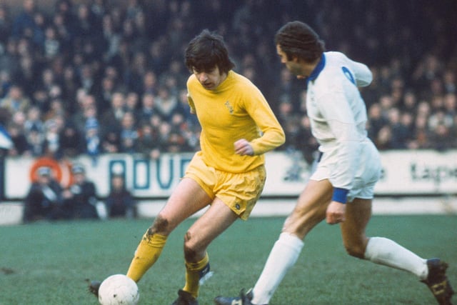 Peter Lorimer crosses the ball against Leicester City at Elland Road.