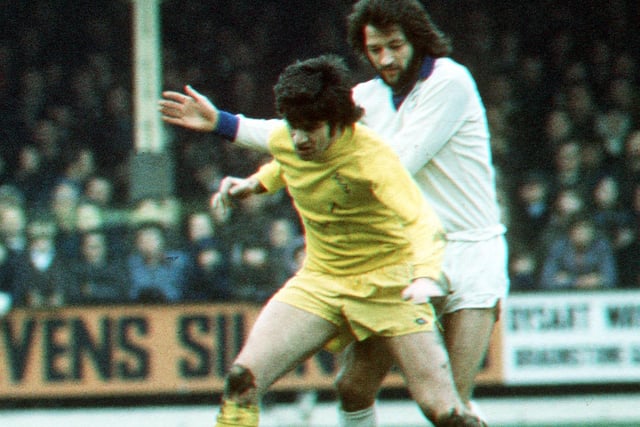 Peter Lorimer and Frank Worthington tussle for the ball.