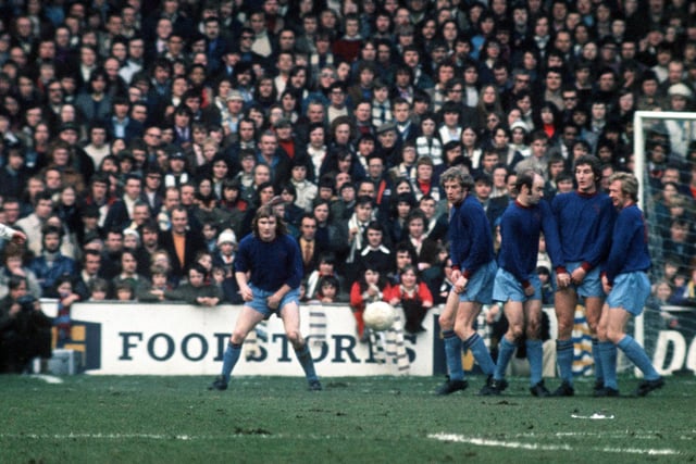 A Peter Lorimer fires a free kick towards goal. Do you recognize the opposition?