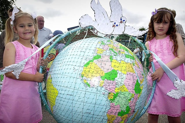 Lilian Snape (left) and Charlotte Boyd carry the world for Holy Trinity Sunday School at Freckleton Club Day