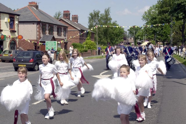 Bilsborrow Festival pom pom dancers and St Peters Marching Band lead the procession through the village