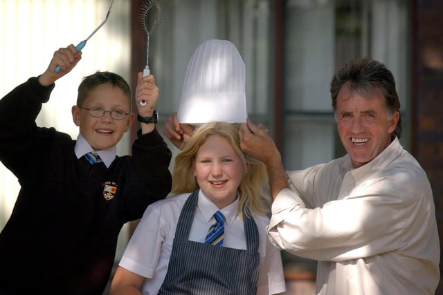 Ex-professional footballer Mark Lawrenson, with Antonia Baron, 13, and her brother Jonathan, 11, winners of the Leyland St. Marys Grant Maintained School masterchef competition
