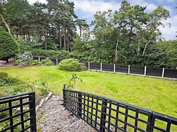 The  property is approached through two sliding electric entrance gates and pedestrian side gates into an extensive gravelled in and out driveway, providing ample private parking and in turn giving access to a three car garage with automatic up and over doors, ceramic tiled floor and central drainage point. Wrought iron pedestrian gates to either side of the property provide access into the private and enclosed rear gardens with illuminated stone paved patio area.
