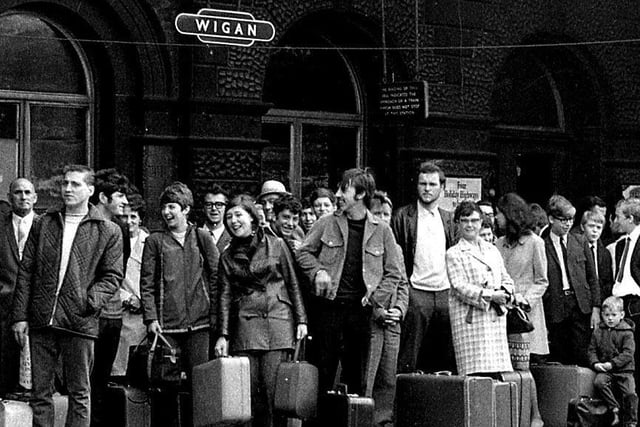 Wigan's workforce gather to board their trains at North West Station to holiday at the seaside, 1969