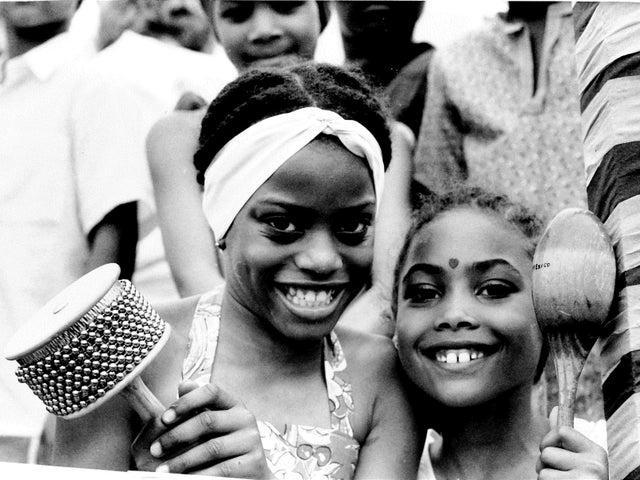 These smiling children from Leopold Primary in Chapeltown are Lavinia Browne, nine, and Shannel Hamilton (right) seven.