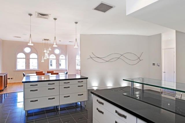 The duplex features a modern, open plan kitchen.