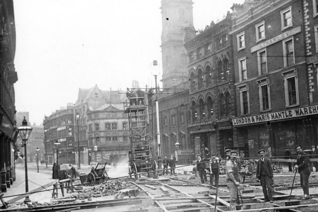 The junction of Briggate and Boar Lane during the relaying of tram tracks in 1899. The tracks were made at Hunslet Steel Works and laid out in a network.