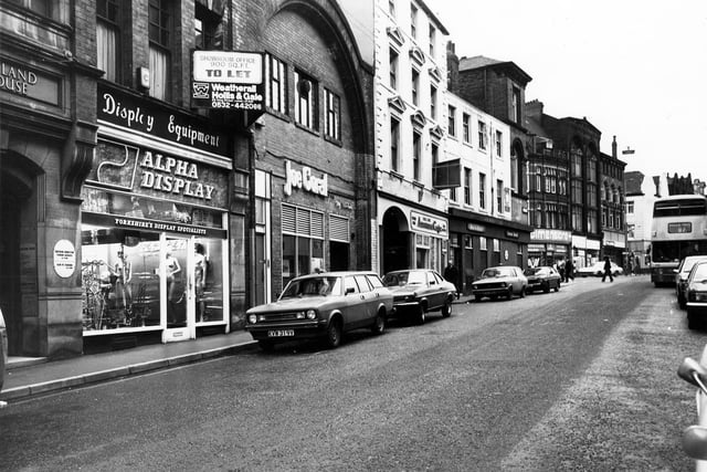 Call Lane. From left Alpha Display Equipment, Joe Coral bookmakers, Call Lane Amusement Centre and Star and Garter pub. Beyond the junction with Duncan Street is Dimensions Hairdressing Salon and Tuition Centre on New Market Street