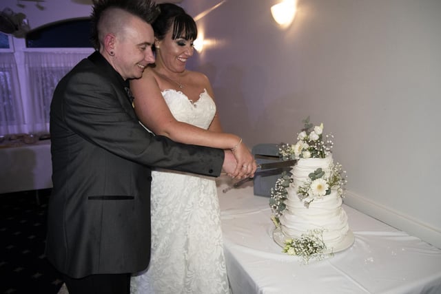 The couple cut their wedding cake. They said having their children with them made their day extra special