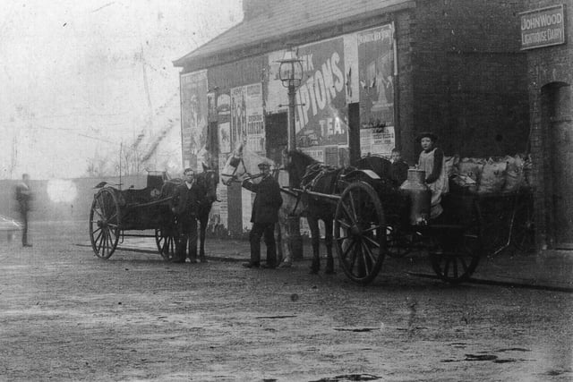 John Wood (centre) owned the Lighthouse Dairy and coal merchants in Lower Lune Street. The carts are outside the dairy, close to the junction with Pharos Street, loaded for their rounds with other members of the family lending a hand. Photo around 1900