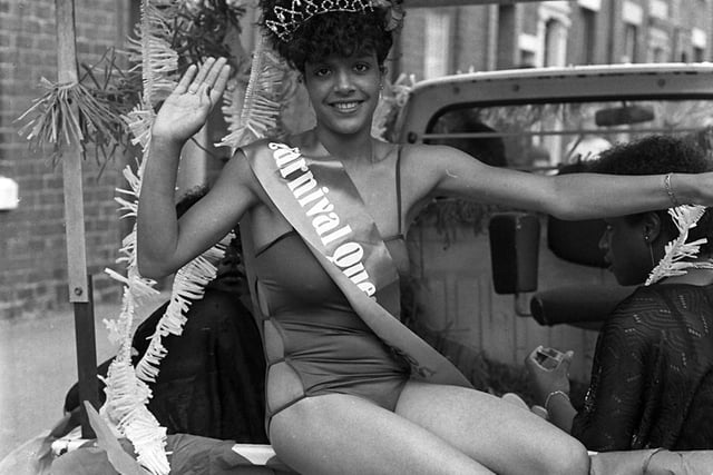 The 1982 Caribbean Carnival Queen waves to the crowds