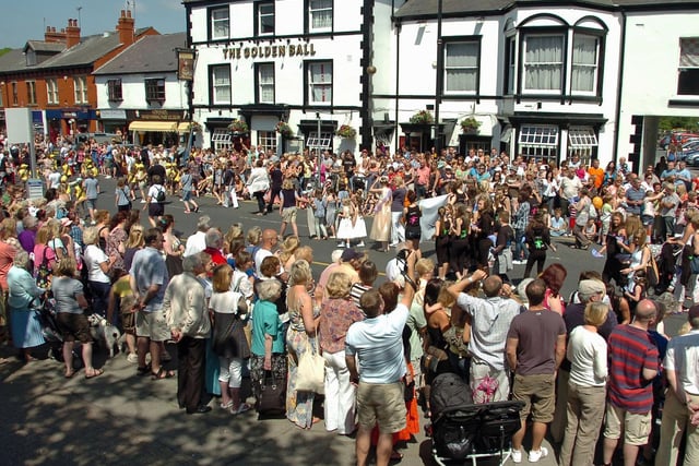 Crowds line the streets outside the Golden Ball pub.