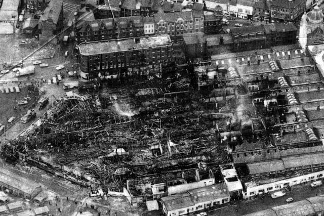 Aerial view of Kirkgate Market, looking south, in the aftermath of the fierce fire of December 13, 1975. The photograph was taken the day after the fire and records the scene of devastation, as much of the market hall dating from 1857 was destroyed.