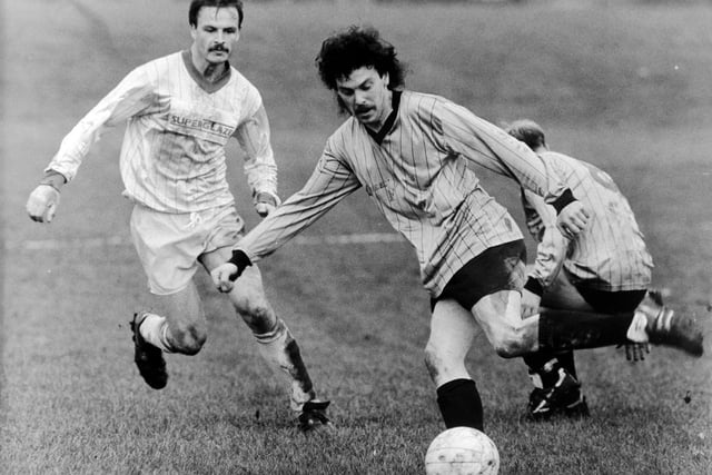 Bernard Hasty of Queens Arms Cavaliers takes on Bramley Social defender Neil Frisby in the Leeds Sunday League Presidents Cup match which finished 2-2 after extra time.
