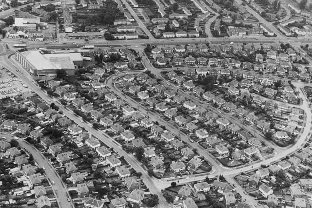An aerial view of Crossgates featuring the Sandway/Hawkhill estate. Cross Gates Road runs left to right across the photos with the Asda sited at its intersection with Cross Gates Lane which comes down to bottom centre.