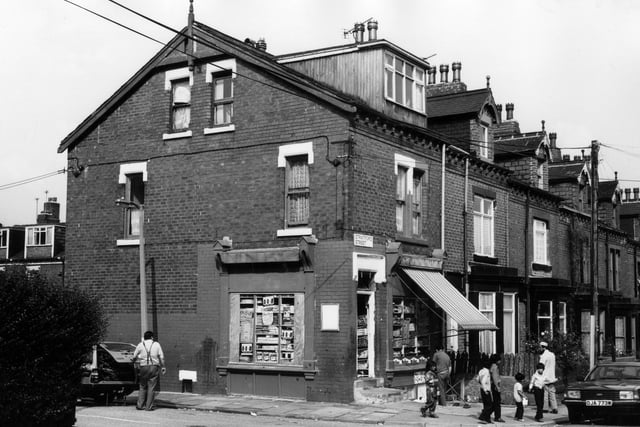 Looking across to Stratford Street from Bude Road in Beeston, showing a corner shop at no. 80, which has a modern dormer window.