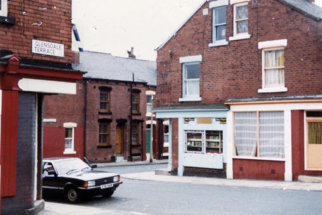 East Park Drive in Burmantofts, seen from Glensdale Terrace, with Charlton Road leading off in the background. On the left is a corner shop at no.32 Glensdale Terrace.