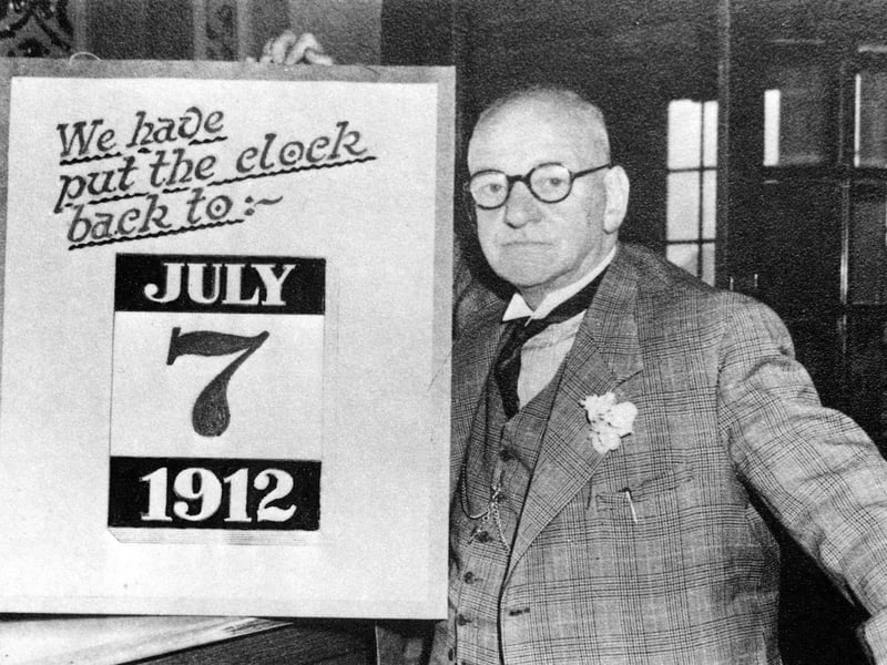 Harry Ramsden at his White Cross fish and chip restaurant in July 1952, with display board 'we have put the clock back to July 7th 1912'