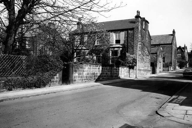 A stone-built detached house at No.41 Grove Road. In the foreground is the junction with Back Grove Gardens. Further along on the opposite side is Claremont Road.