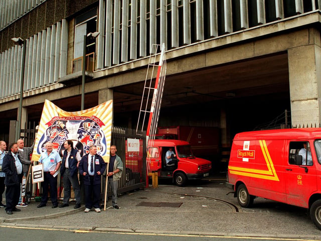 Postal workers on picket duty in Leeds at the start of a second one day strike.