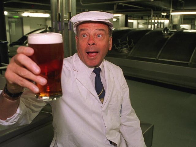 Dickie Bird eyes up a pint of Tetley's Bitter after opening the Dickie Bird Room at Tetley's Brewery, a new fermenting room with four new 'Yorkshire Squares'.