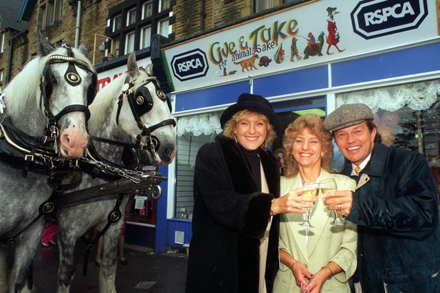 Emmerdale stars Frazer Hines and Liz Hobbs open the new RSPCA shop on Street Lane in Roundhay. Also pictured is Elizabeth Lindsay, appeal shops area manager,  and Prince and Charles, the Shire horses from Tetley.