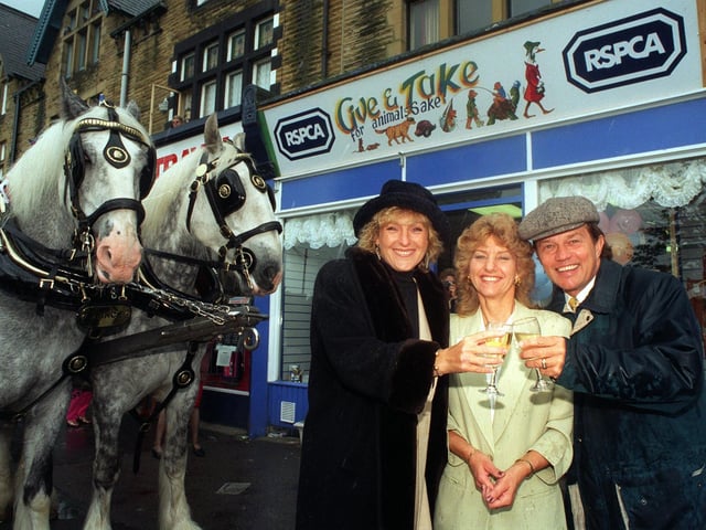Emmerdale stars Frazer Hines and Liz Hobbs open the new RSPCA shop on Street Lane. Also pictured is Elizabeth Lindsay, appeal shops area manager,  and Prince and Charles, the Shire horses from Tetley.