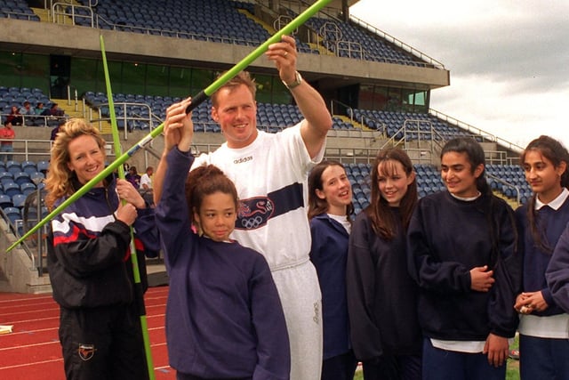 Olympic javelin thrower Mick Hill, aided by Maggie Still, athletics development officer gives throwing training for a group of girls from Parklands High at South Leeds Sports Stadium. Under tuition is Sharlene Anderson.