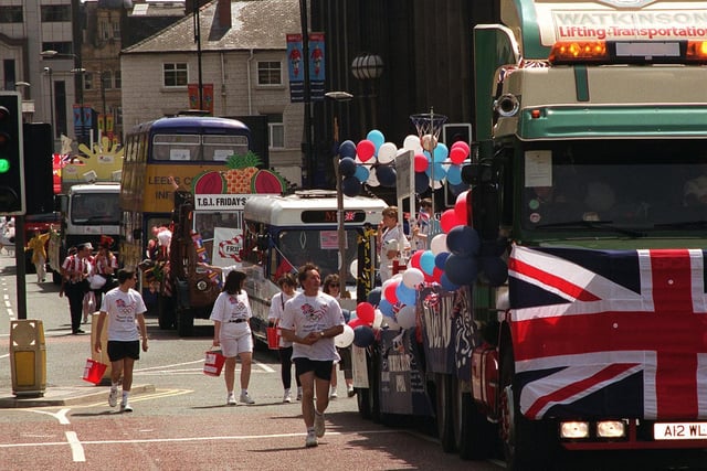Some of the floats in the Leeds Lord Mayor's Parade make their way along Calverley Street in the city centre.
