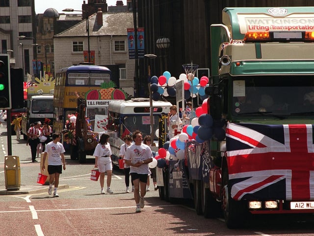 Some of the floats in the Leeds Lord Mayor's Parade make their way along Calverley Street in the city centre.