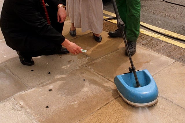 This is not a vacuum cleaner but a chewing gum busting machine bought by Leeds City Council and being demonstrated on white flagstones outside the Civic Hall.