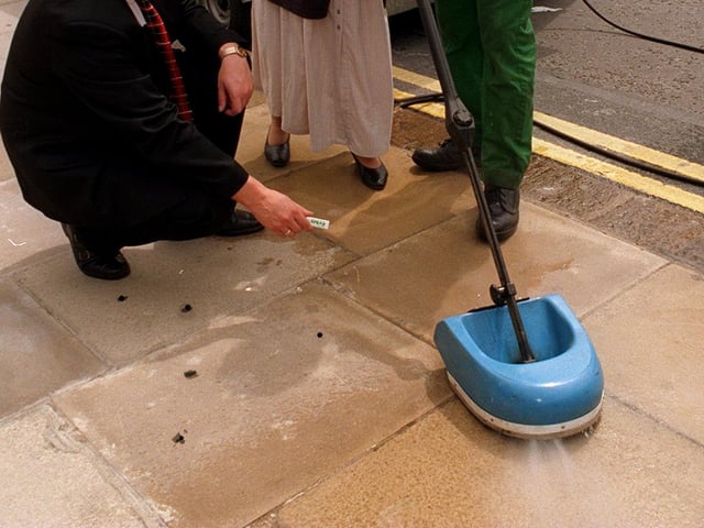 This is not a vacuum cleaner but a chewing gum busting machine bought by Leeds City Council and being demonstrated on white flagstones outside the Civic Hall.