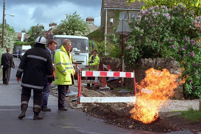 Workmen laying cable TV on West End Lane in Horsforth accidentally cut through a gas sevices pipe causing a four foot flame near a house, pictured fire and gas officers inspecting the damage.