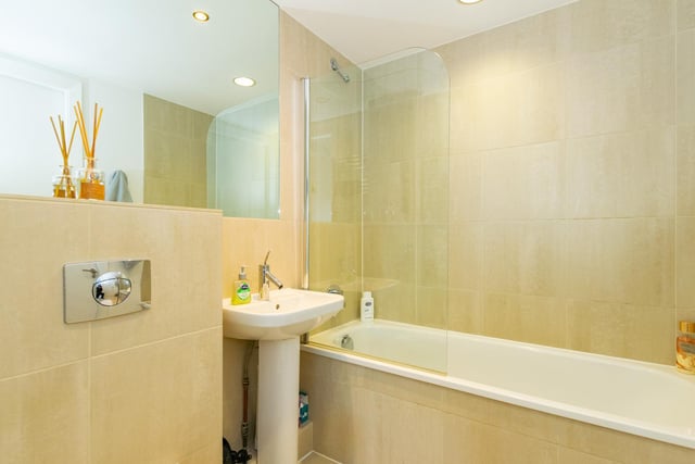 There is a modern main bathroom as well, with a shower and bath.