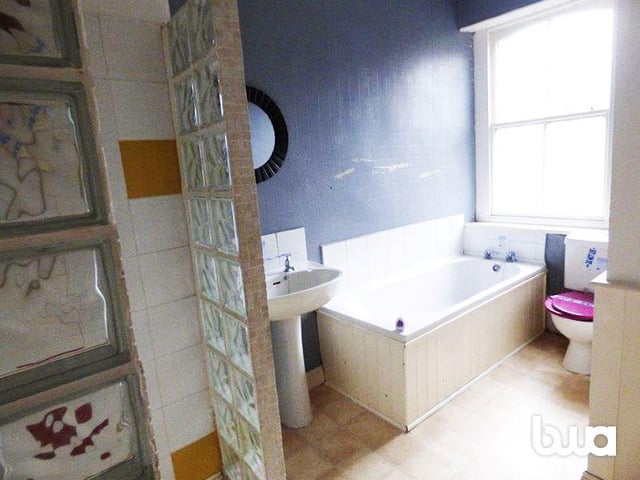 Upstairs there is a bathroom with enough space for a bathtub.