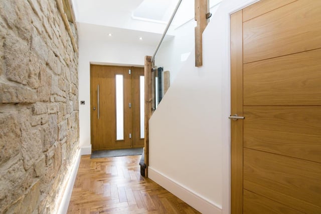 The front double doors open into the hallway where there is the first glimpse of this spectacular renovation.