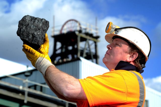 Former miner Ian Cunniff, who used to work at Kellingley Colliery for 11 years holds up one of the last pieces of coal to be brought to the surface from Kellingley Colliery at the National Coal Mining Museum.