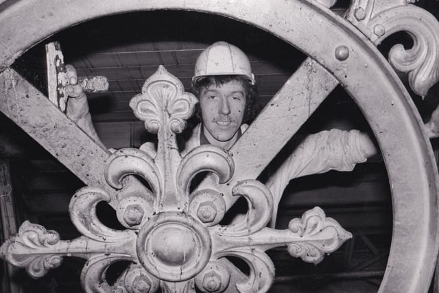 Graham Mills works from removing the grime from the metalwork in the ceiling in April 1981.