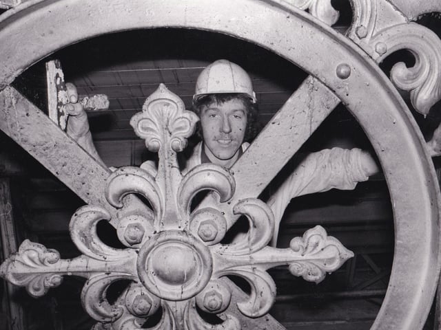 Graham Mills works from removing the grime from the metalwork in the ceiling in April 1981.