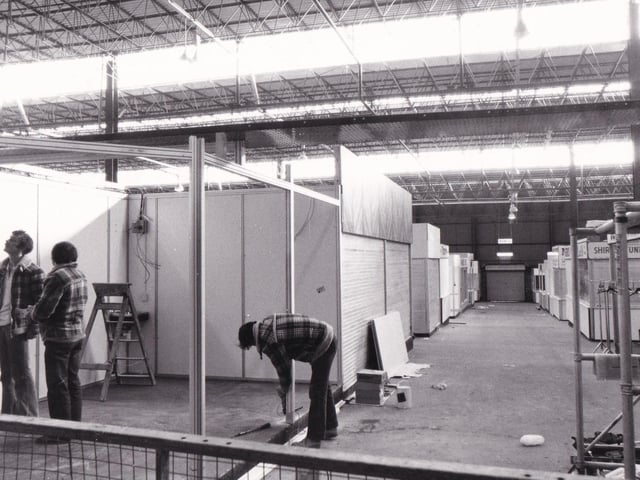 Workmen put the finishing touches to some of the new stalls in the new look market in November 1981.