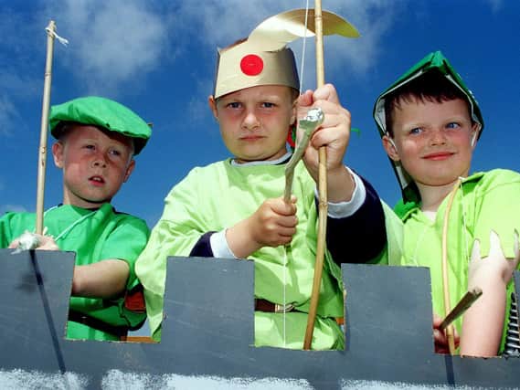 (From left) Dain Graham (7), Andrew Thornton (6) and Dylan Howell (6) manning the battlements on the St Paul's Church and 1st Fleetwood float in 1998